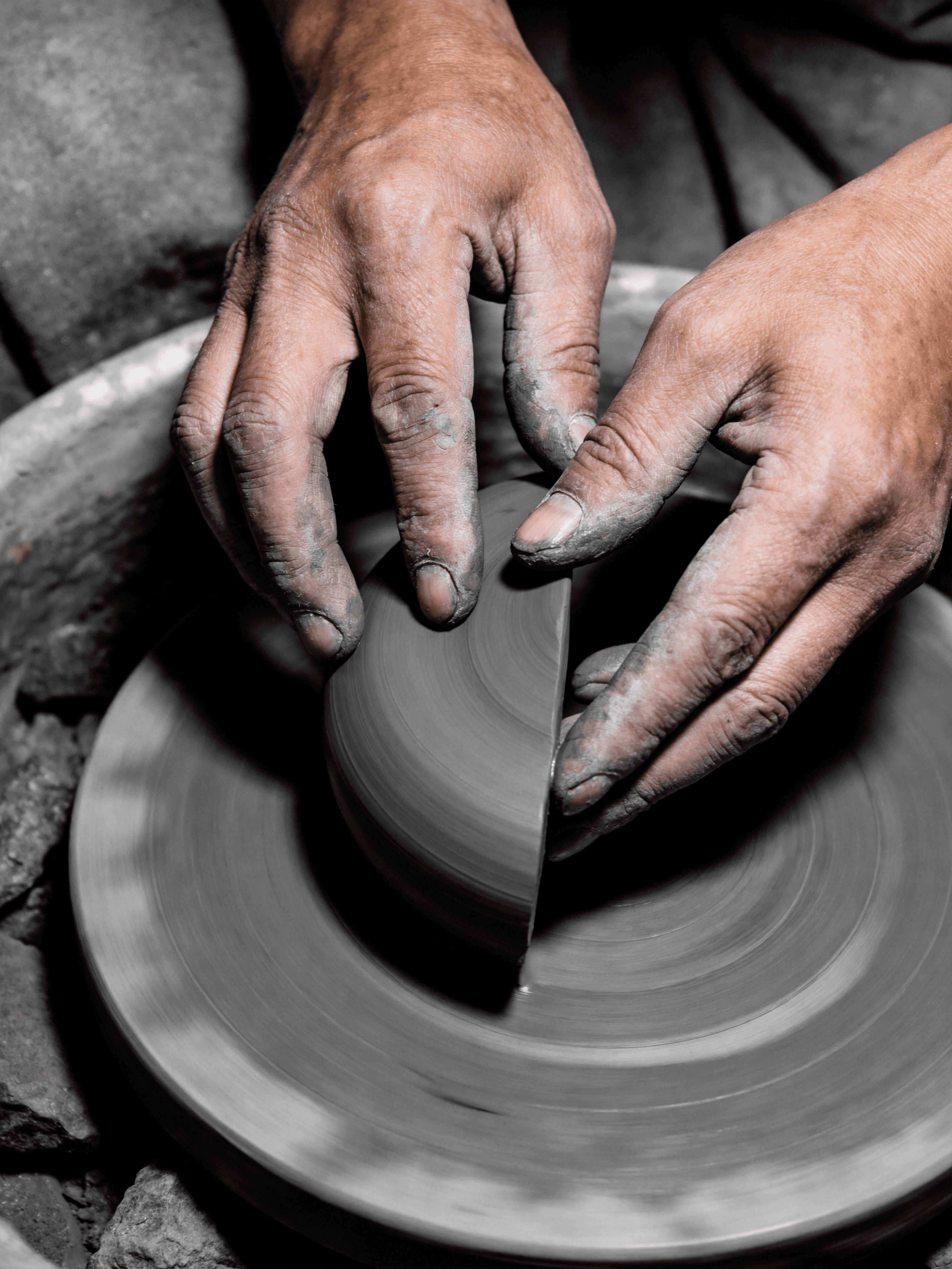 Artisan shaping clay